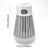 Portable bug zapper lamp hanging outdoors on patio at night
