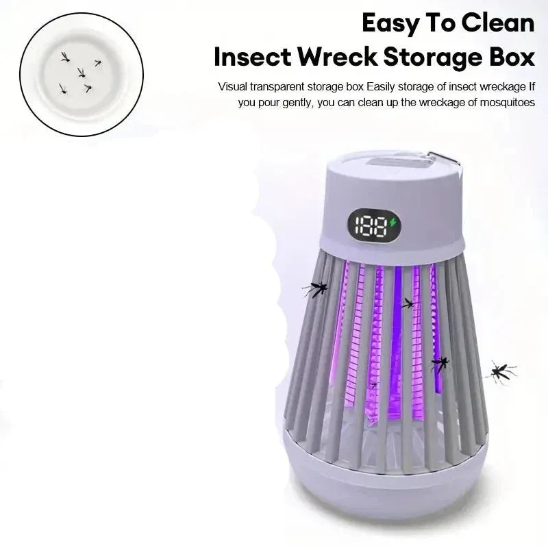 Portable bug zapper lamp hanging outdoors on patio at night