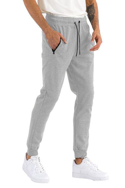 Heathered cotton sweatpants in grey blend, front view showing zip pockets and drawstring waist
